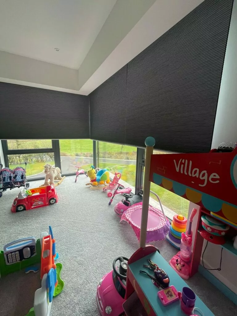 cellular blinds in large corner window of play room  Village Blinds and Shutters Northern Ireland