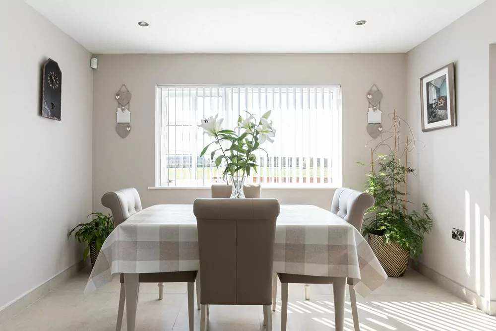 vertical blinds open in bright dining space
