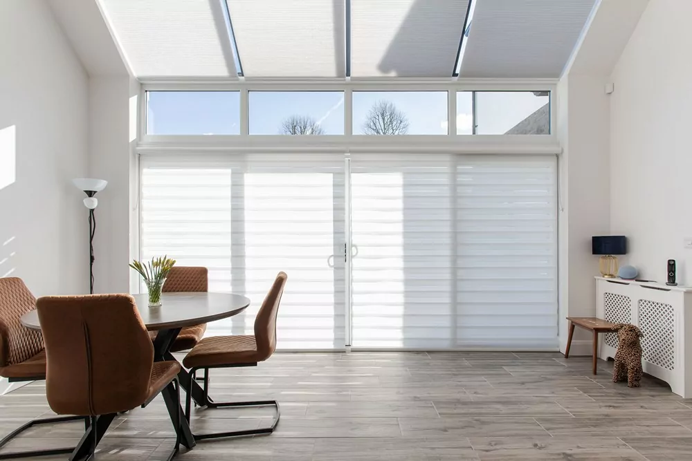 aura blinds and motorised cellular blinds in dining space
