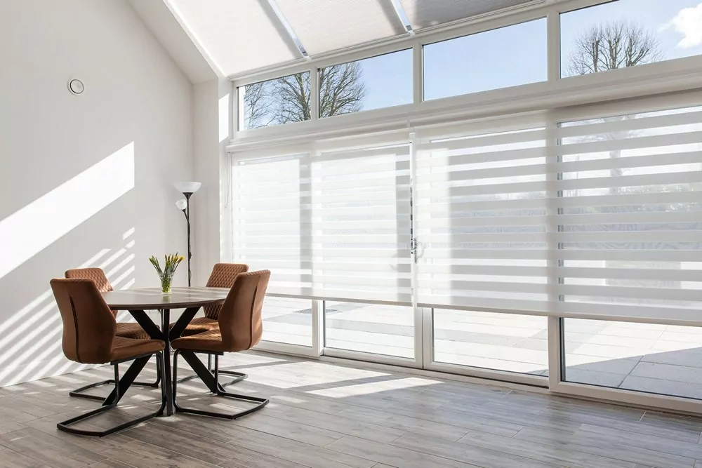 motorised cellular blinds on a roof with aura blinds in dining space