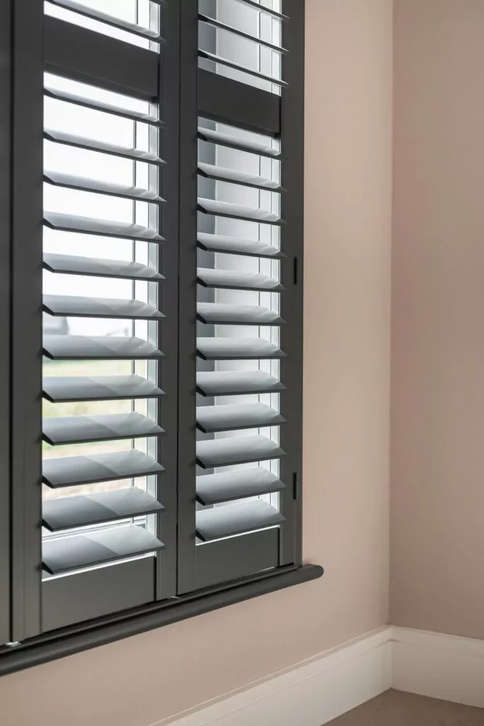 Close up images of Basalt Grey Painted Plantation Shutters in Living Room - Village Blinds and Shutters Northern Ireland