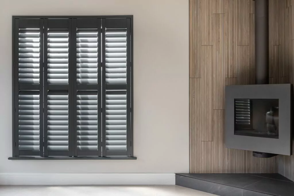 Modern Living Room With Basalt Grey Painted Plantation Shutters in Living Room - Village Blinds and Shutters Northern Ireland