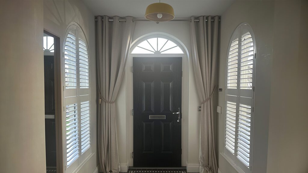 arched window example modern contemporary new build home in northern ireland with shaped plantation shutters