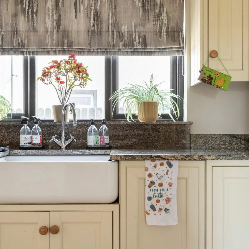 roman blinds in kitchen at sink
